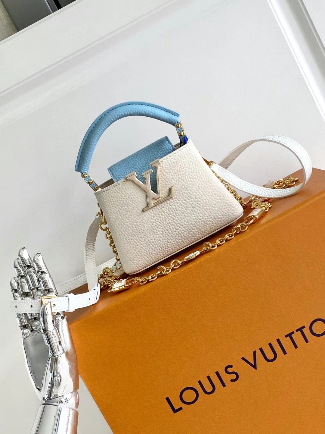 Capucines Mini Grained Leather Sky Blue Top Handle Bag
